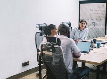 Operation efectiveness team collaborating in boardroom