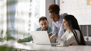 team discussing on laptop