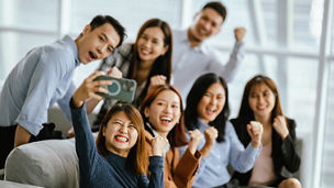 Happy business team having fun while taking a selfie with smart phone after having a seminar in a modern office. - Business presentation