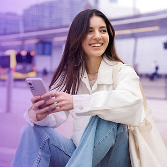 Woman waiting for the bus and smiling