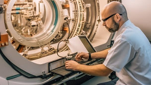Technician operating advanced laboratory testing equipment