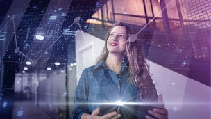 Businesswoman in a technology world concept with data overlay