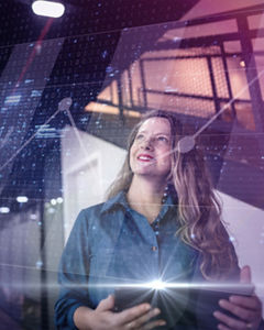 Businesswoman in a technology world concept with data overlay