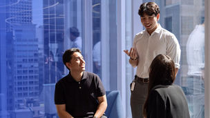 Three colleagues talking