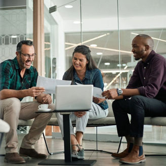 Three collegues discussing at office