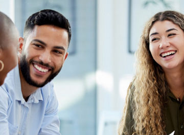 People smiling whilst looking at eachother