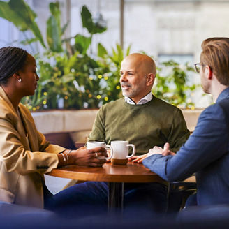 Three people talking