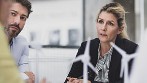 three-women-and-a-man-discussing