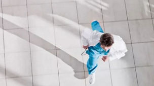 Top view of a doctore walking through corridor