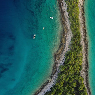 Top-view of sea & island with boats