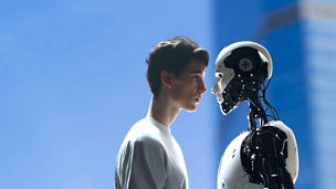 A person standing next to a robot