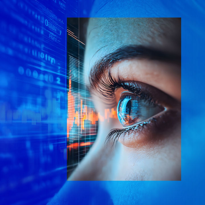 Close-up of eyeball in front of interactive screen