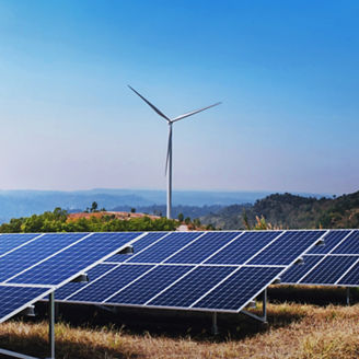 concept clean energy power in nature. solar panel and wind turbine on hill with sunshine