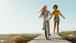 two-women-laughing-and-riding