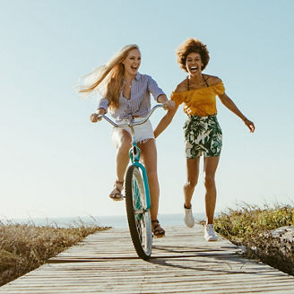 two-women-laughing-and-riding