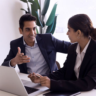 two-colleagues-discussing-business