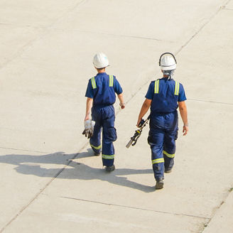 Two engineer walking on the ground