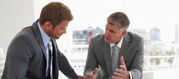 Two men at a meeting