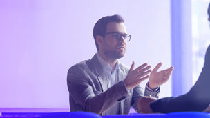 A men who is talking with his colleague