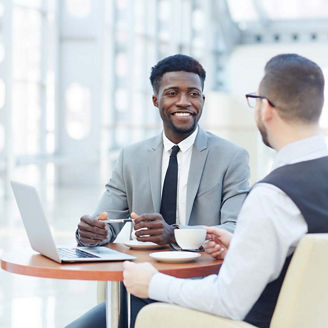 Two men discussing something in office