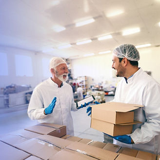 Two men in lab laughing