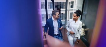 Two people talking in office