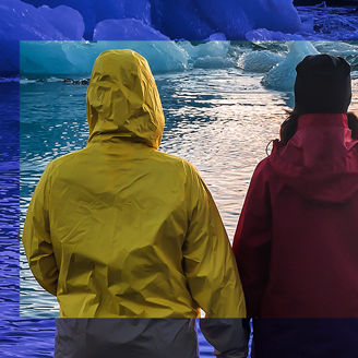 two-people-watching-floating-icebergs-banner