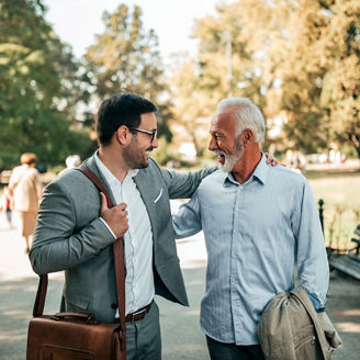 Two professionals having a business conversation while walking in a park