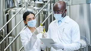 Two scientists holding test-tubes