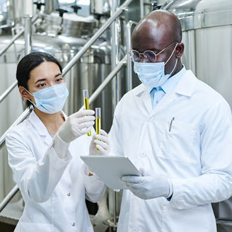 Two scientists holding test-tubes