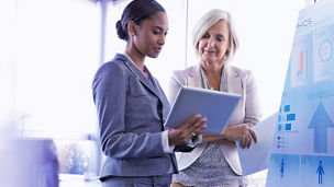 two women looking at screen