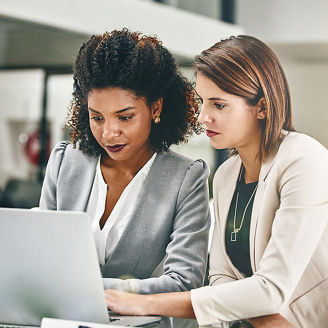 two-women-looking-at-the-laptop