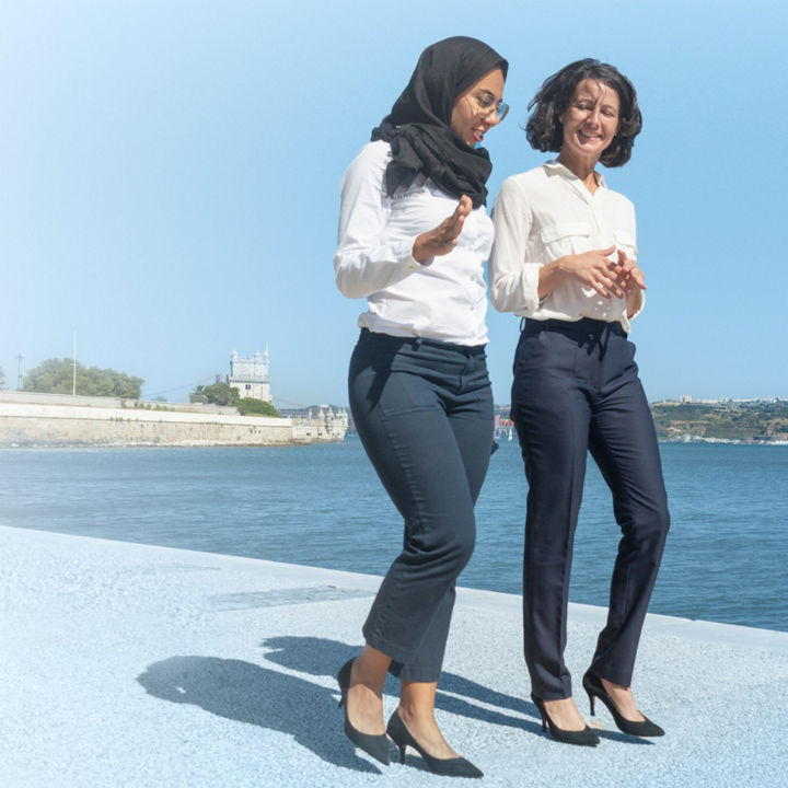 Two women walking and talking