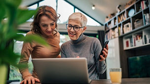 Two women working together