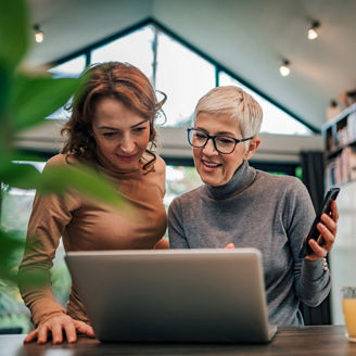 Two women working together