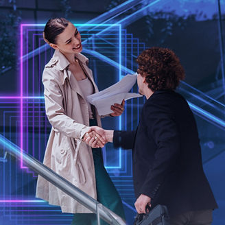 Two young workers shaking hands