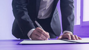 Man working with AI software on tablet