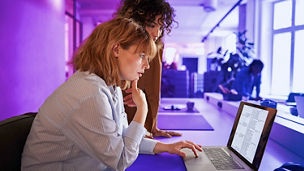 two women working together