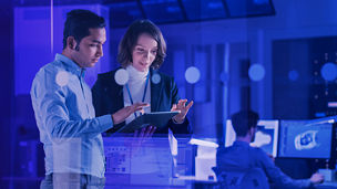 Colleagues chat on the tablet