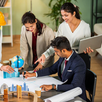 Indian asian Architect, builder and engineer meeting together and discussing city planning on table