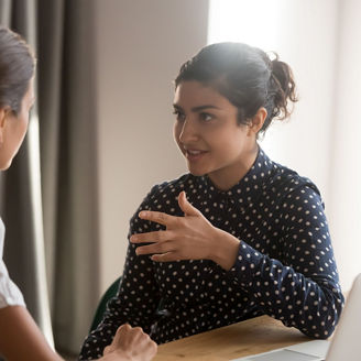 Mentor talking to colleague