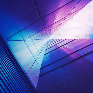 View through high rise skyscraper upwards towards the sky