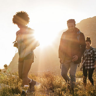 Young people walking through countryside