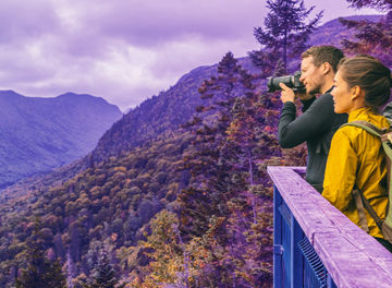 Couple watching the view standing on mountain