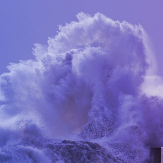 Waves crashing near lighthouse banner