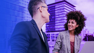 Businessman and businesswoman working together outside