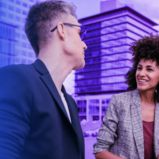 Businessman and businesswoman talking outside