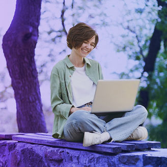woman working on her laptop outside