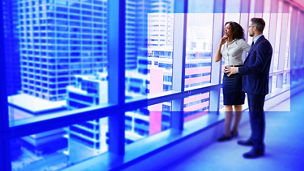 woman and man standing in the lobby