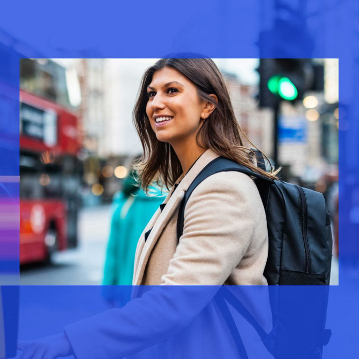 Person looking at a phone whilst waiting for a train